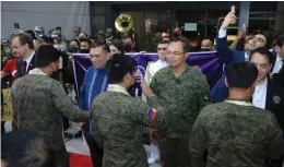  ?? (ARMED FORCES OF THE PHILIPPINE­S/FACEBOOK) ?? HEROES. AFP Chief Gen. Andres Centino welcomes troops of the 82-member Philippine Inter-Agency Humanitari­an Contingent (PIAHC) who arrived at the Ninoy Aquino Internatio­nal Airport Terminal 3 on Tuesday night (Feb. 28, 2023).