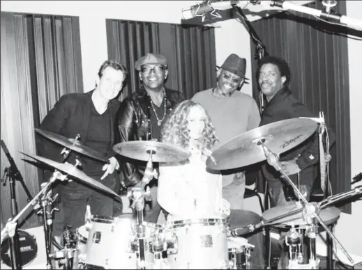  ??  ?? Mariah Carey (seated) with (from left) a drummer, Randy Jackson, Loris Holland and guitarist Doc Powell.