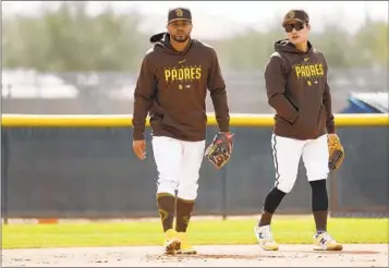  ?? K.C. ALFRED U-T ?? Shortstop Xander Bogaerts (left), with Ha-Seong Kim in a Padres spring workout, brings winning approach.