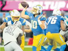  ?? USA TODAY SPORTS ?? Chargers QB Justin Herbert, No.10, plays against the Raiders.