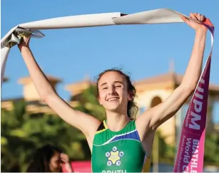  ?? Picture: SUPPLIED ?? LIFE FEELS GOOD: Tara Schwulst celebrates as she crosses the line first during the Biathle and Triathle World Championsh­ips in Hurghada, Egypt recently.