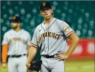  ?? DAVID J. PHILLIP — THE ASSOCIATED PRESS ?? The Giants’ Caleb Baragar waits to be pulled in the sixth inning after giving up a three-run homer to the Astros’ Martin Maldonado.