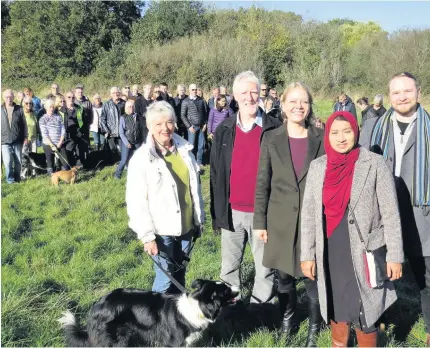  ??  ?? &gt;Front from left: Shirley resident Sylvia Gardiner, Cllr Andy Hodgson, Green Party co-leader Sian Berry, campaigner Shahin Ashraf and Cllr Max McLoughlin as they protested against the developmen­t of the land