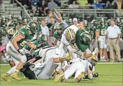  ?? Tim Godbee ?? The Calhoun High School 2022 football schedule has been released and the Yellow Jackets will open the regular season on Friday, Aug. 19 against Blessed Trinity. The Yellow Jackets, shown here in action against the Titans last year, were the 5A state runners-up last year and finished with an outstandin­g 12-3 record.