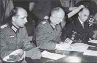  ?? PICTURE: GETTY ?? CONFLICT END: Chief of the Operations Staff Alfred Jodl signs the unconditio­nal surrender at General Eisenhower’s HQ.