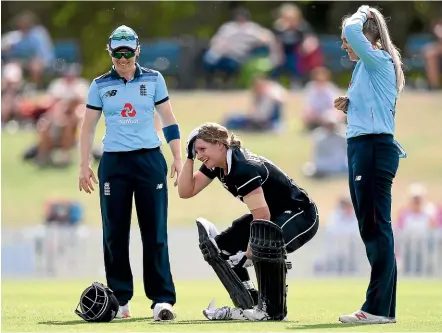  ?? GETTY IMAGES ?? White Fern Brooke Halliday manages to smile after being hit on the helmet while running between wickets.