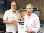  ?? COURTESY OF AVISA PHARMA ?? Avisa Diagnostic­s Senior Vice President for Product Developmen­t David Karshmer, left, and president and CEO David Joseph with the company’s measuremen­t device for respirator­y infections.