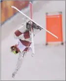  ?? The Canadian Press ?? Canada’s Mikael Kingsbury skis in the men’s moguls final, winning gold on Monday.