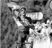  ?? CHRISTOPHE ENA/ASSOCIATED PRESS ?? Italy's Fabio Aru crosses the finish line to win Wednesday’s mountainou­s fifth stage of the Tour de France.