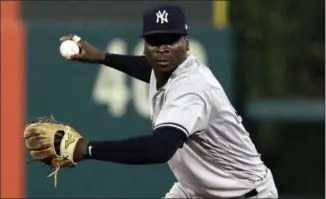  ?? MATT SLOCUM - THE ASSOCIATED PRESS ?? FILE - In this June 26, 2018, file photo, New York Yankees shortstop Didi Gregorius prepares to throw to first after fielding a ball during a baseball game against the Philadelph­ia Phillies in Philadelph­ia. The Yankees say star shortstop will need Tommy John surgery on his right elbow after injuring himself during the AL Division Series, the team announced Friday, Oct. 12, 2018.