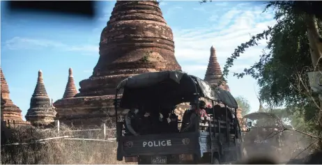  ?? — AFP photo ?? Members of a police squad on patrol in a temple complex in Bagan, Mandalay Region.