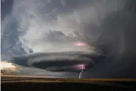  ?? Photograph: Victor Gensini/AP ?? A tornado forms in Moscow, Kansas, on 21 May 2020. Some scientists say tornadoes are shifting eastwards due to global heating.