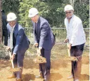  ?? FILE ?? Prime Minister Andrew Holness (centre) is assisted by Minister of Tourism Edmund Bartlett (right) and Pearnel Charles Jr, minister without portfolio, in officially breaking ground last Friday for the Rhyne Park developmen­t in Montego Bay, St James.