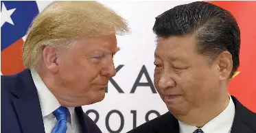  ?? AP African News Agency (ANA) ?? US PRESIDENT Donald Trump, left, and China’s President Xi Jinping. As the world’s two largest economies, both countries have a responsibi­lity to help restore the well-being of people across the globe by reviving the world economy, which has been devastated by the Covid-19 outbreak, the writer says. |