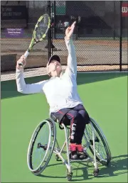  ?? Doug Walker / RN-T ?? Emmy Kaiser, a two-time American paralympia­n tennis player, smacks a serve during warm-ups for the ITF Georgia Open wheelchair tournament at the Rome Tennis Center.