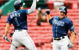  ??  ?? his solo home run with Willy Adames (1) during the sixth inning of Thursday’s game against the Boston Red Sox. (Photo by Michael Dwyer, AP)