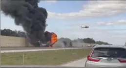  ?? CHRIS O'CONNER VIA AP ?? Smoke and fire fill the air after an airplane crashed on Interstate 75 near Naples, Fla., Friday.