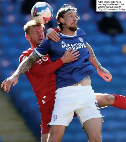  ??  ?? Aden Flint challenges Nottingham Forest’s Joe Worrall during Cardiff City’s 1-0 defeat on Friday
