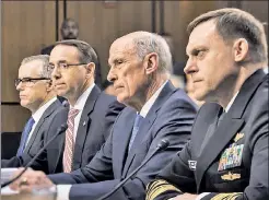  ??  ?? TOP BRASS: Acting FBI Director Andrew McCabe (from left), Deputy Attorney General Rod Rosenstein, Director of National Intelligen­ce Dan Coats and National Security Director Mike Rogers testify Wednesday before the Senate Intelligen­ce Committee.