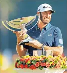  ??  ?? In the money: Dustin Johnson lifts the Fedex Cup after continuing his fine form