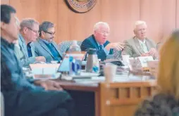  ?? EDDIE MOORE/JOURNAL ?? Sen. John Arthur Smith, D-Deming, second from right, talks during a meeting of the Legislativ­e Finance Committee on Monday in Santa Fe. “We have a lot of rebuilding of foundation still to do,” Smith said of projected “new” money available for next...