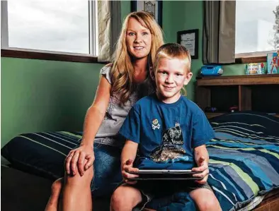  ?? Bryce Meyer / New York Times ?? Kim Slingerlan­d was troubled to learn that a game app she downloaded for her son, Shane, had shared personal data, including location informatio­n.