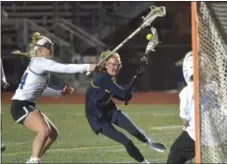  ?? PETE BANNAN — MEDIANEWS GROUP ?? Unionville’s Emma Malone (3) moves in on the Kennett goalie as Kennett’s Peyton Hunt defends off a free position.