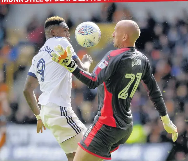  ??  ?? Britt Assombalon­ga tried to flick the ball past Wolves’ keeper John Ruddy. The visiting fans and Boro boss Garry Monk believed Ruddy handled the ball