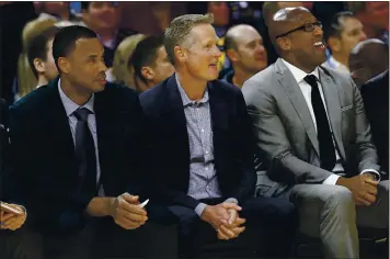  ?? JANE TYSKA — THE ASSOCIATED PRESS ?? Warriors head coach Steve Kerr, center, and assistant coaches Jarron Collins, left, and Mike Brown, right, have used informatio­n from the team’s analytics department, which has doubled in size since the start of last season.