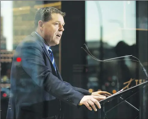  ?? DAVID BLOOM/POSTMEDIA NEWS ?? Hockey Canada president and COO Scott Smith talks to reporters during yesterday’s news conference to announce that the 2021 IIHF world junior hockey championsh­ip will be held in Edmonton and Red Deer, Alta.