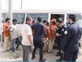  ??  ?? KUWAIT: This handout photo shows police round up a number of people during a security campaign at Amghara scrap yard yesterday. —Interior Ministry photos