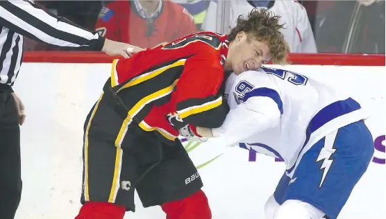  ?? JIM WELLS ?? Calgary Flames second-year winger Matthew Tkachuk has establishe­d a reputation around the NHL for his toughness, evidenced by this fight against Tampa Bay’s Jake Dotchin.