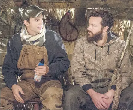 ?? NETFLIX ?? Ashton Kutcher, left, and his old friend from That ’70s Show, Danny Masterson, are together again on the small screen in the new Netflix sitcom, The Ranch.