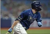  ?? CHRIS O’MEARA — THE ASSOCIATED PRESS ?? Tampa Bay Rays’ Austin Meadows head for first base after his RBI single off Boston starting pitcher Nick Pivetta during the third inning Monday in St. Petersburg, Fla. Rays’ Brandon Lowe scored on the play.