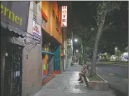  ??  ?? Homeless sex worker Angora, 26, waits outside a hotel as she tries to earn money after having her bag stolen by a man pretending to be a client in Mexico City.