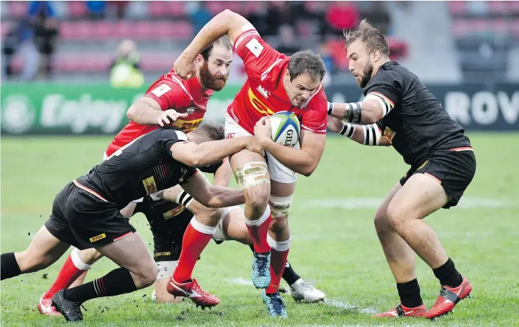  ?? — GETTY IMAGES ?? Canada’s scrum half Phil Mack tries to escape a tackle during the 2019 Japan Rugby Union World Cup qualifier against Germany on Saturday. Canada won, 29-10.