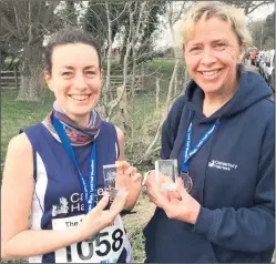  ??  ?? Sarah Brenton, left, and Leisa Foad – two of the three Canterbury Harriers who took the team prize at Lydd