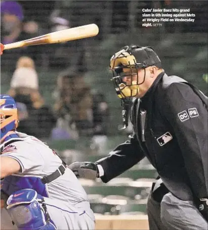  ?? GETTY ?? Cubs’ Javier Baez hits grand slam in 6th inning against Mets at Wrigley Field on Wednesday night.