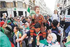  ?? AP ?? Thousands of Algerians take to the street to commemorat­e the first anniversar­y of the popular protests in Algiers on Friday.