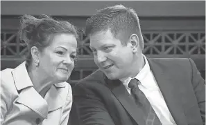  ?? AP ?? Chicago police Officer Jason Van Dyke, charged with murder in the shooting of black teenager Laquan McDonald in 2014, talks with one of his attorneys, Tammy Wendt, in Chicago on Sept. 6.