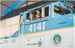  ?? UNION PACIFIC 2005 ?? George H.W. Bush looks out of the cab of Union Pacific locomotive 4141 at its unveiling.