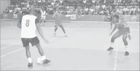  ??  ?? Wendell Austin (no.8) of Tiger Bay attempting a pass while being watched closely by a Dave and Celina’s All-Stars marker, during their matchup at the National Gymnasium on Mandela Avenue on Thursday.