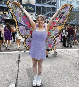  ?? KRISTEN MOHAMMADI PHOTOS / PITTSBURGH POST-GAZETTE ?? Taylor Swift fan Keirsten Pollard, 23, of Toronto, Canada poses in front of Acrisure Stadium in Pittsburgh before the “Eras Tour” concert on June 16.