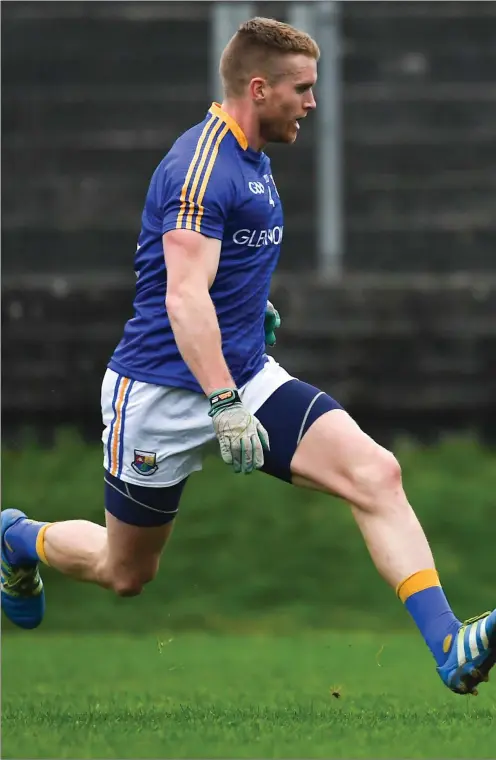  ??  ?? Louth’s Ciaran Downey drops the shoulder to go past Longford’s Shane Donohoe during Saturday’s O’Byrne Cup clash between the sides.