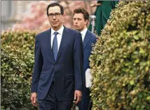  ?? EVAN VUCCI / ASSOCIATED PRESS ?? Treasury Secretary Steven Mnuchin arrives to speak to reporters Friday about the economic impact of the coronaviru­s at a White House news conference in Washington, D.C.