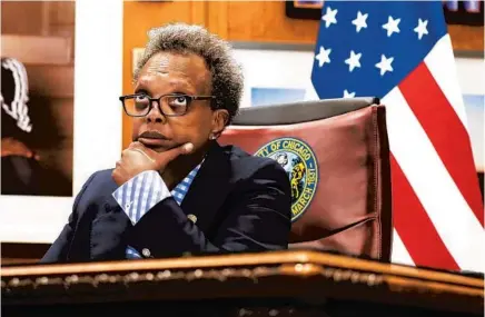  ?? JOSE M. OSORIO/CHICAGO TRIBUNE ?? Mayor Lori Lightfoot conducts a virtual City Council meeting from her office at City Hall on June 17, 2020.