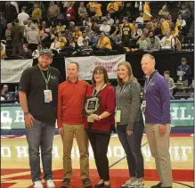  ?? Submitted photo ?? The Ohio Preps Sportswrit­er Associatio­n inducted the late Chuck Ridenour into the OPSWA Hall of Fame on Sunday afternoon in the University of Dayton Arena. From left, Jake Furr, Charlie Ridenour, Pam Ridenour, Brooke Alt, and Tim Stried (right, OHSAA director of media)