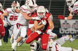  ?? Christian Abraham/Hearst Connecticu­t Media ?? Greenwich’s Jack Konigsberg (5) is taken down during the CIAC Class LL championsh­ip against Fairfield Prep at Rentschler Field in East Hartford on Dec. 10. The teams will meet again in Week 1 to start next season.