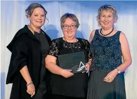  ?? Photo: SUPPLIED ?? Margaret Scott, centre, accepts another award for Travelsmar­t Palmerston North from Travel Managers Group general manager Cath Mcleod, left, and Globus Family of Brands’ Kate Imrie.