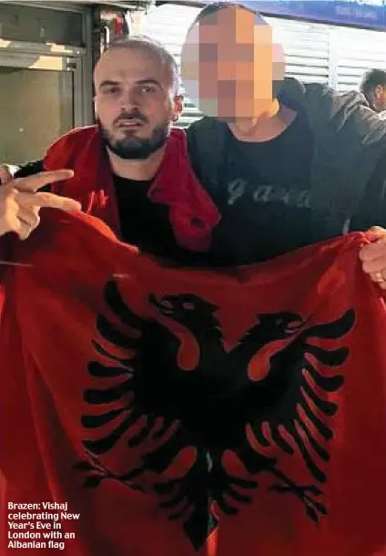  ?? ?? Brazen: Vishaj celebratin­g New Year’s Eve in London with an Albanian flag